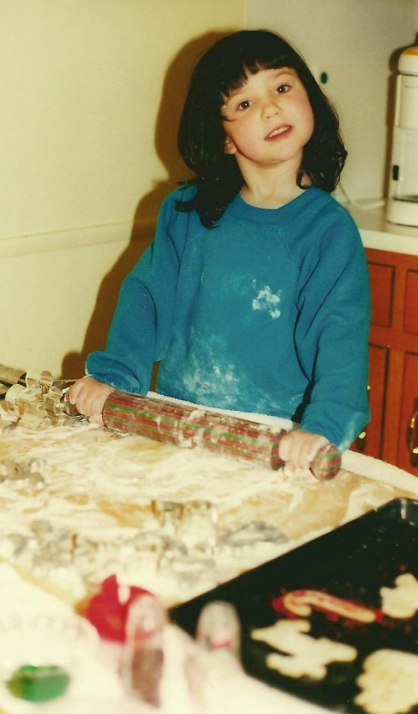Catherine, age 4, helping keep the Christmas cookie tradition alive.