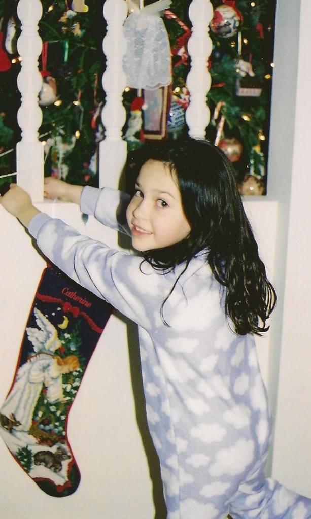 Catherine -- probably age 7 (I REALLY need to make those photo albums) -- getting ready for Santa's arrival.