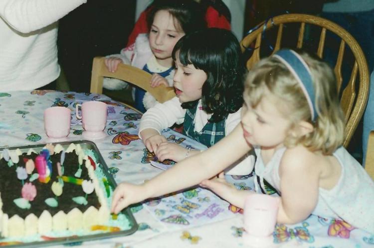 Ah, yes, the garden party cake. Making those flowers sounded so very easy. Until I was there at the kitchen counter for hours flattening those blasted gumdrops with a rolling pin, then using the kitchen shears to shape them.