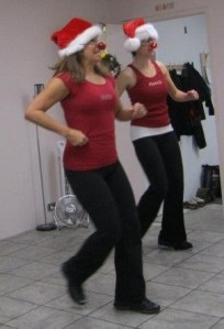 Teaching the holiday class. Kristen is the attractive brunette on the left. That is me on the right, the one wearing her nose at a rakish angle.