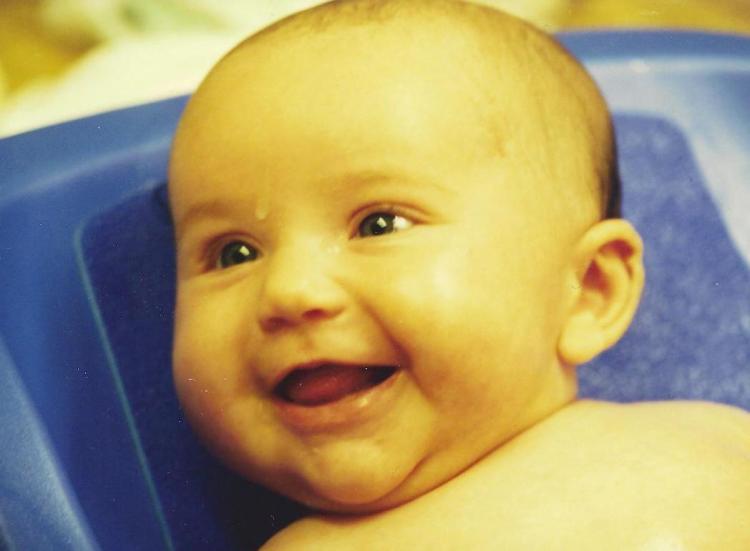 Catherine, 2 months, lovin' her bath.