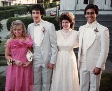 John and I are in the center. We had different dates, but managed to wear the same hairstyle. He still hasn't lived that '80s perm down. 