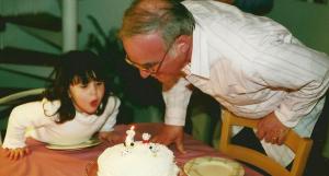 Blowing out the candles with Grandpa in 2000.