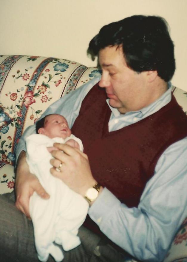 Catherine and Basil, just home on April 3, 1996. Note that he got dressed up for the occasion (and that he has no gray hair!)