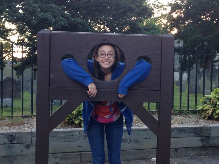 Catherine cools her heels in the stocks during our visit to Salem last week. 