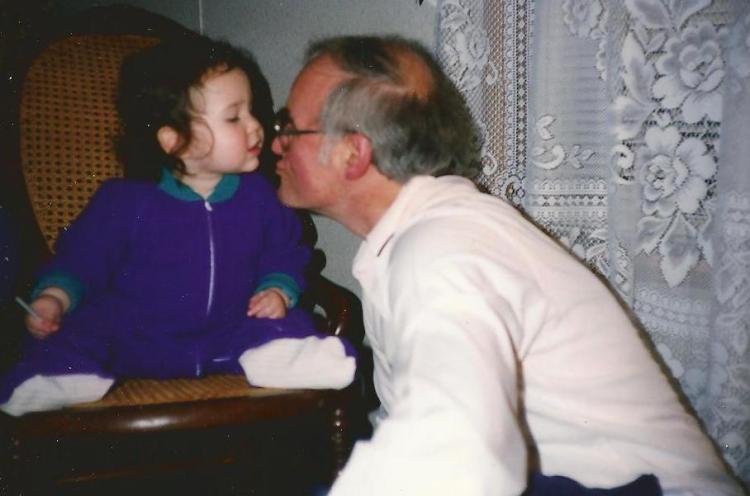 Many years and several sets of curtains ago, Catherine gives Grandpa a kiss.