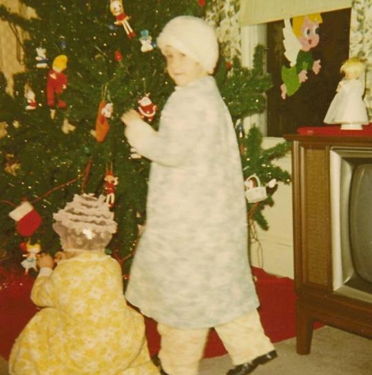 Trimming the tree, 1971. I'm at right, and I'm not wearing a swim cap. There are curlers in my hair.