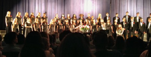 Catherine is called up during the senior sendoff. The kids each presented their director, Patrick Taylor, with a rose as part of the ceremony. Here Catherine adds hers to the bouquet.