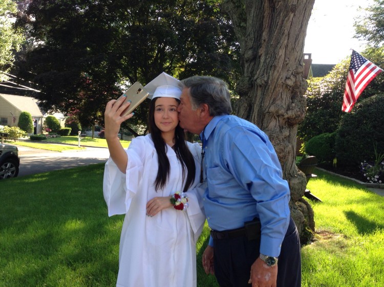 "I'm going to graduation, but first let me take a selfie."