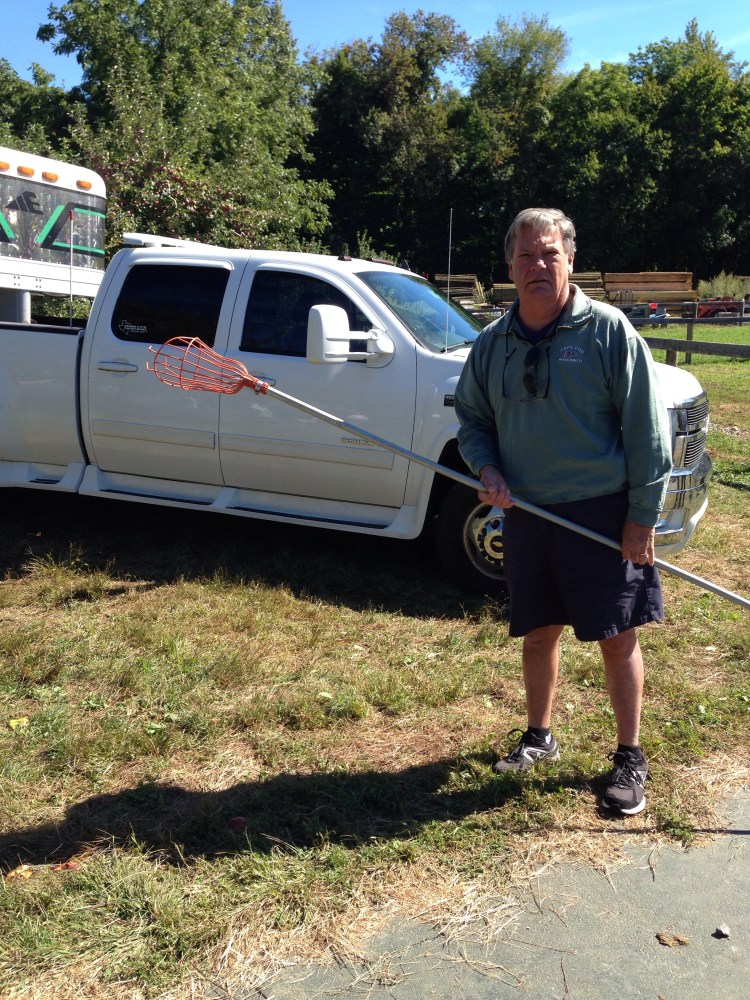A good sport apple picking.