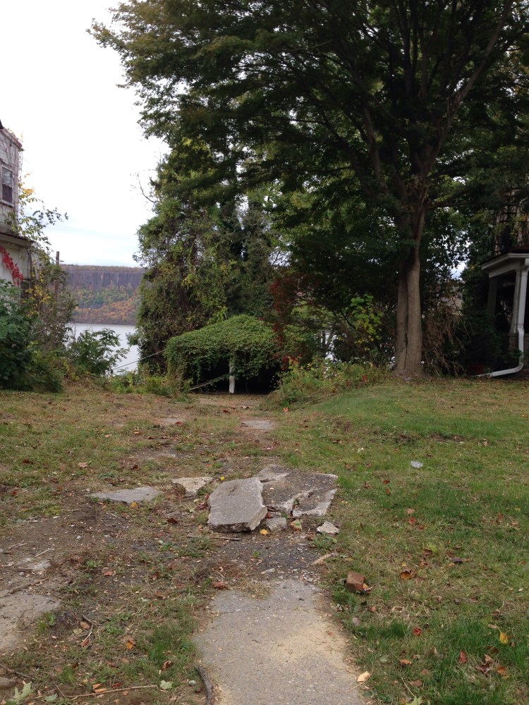 The earth seems to be reclaiming the garage. You can glimpse the Hudson beyond it.