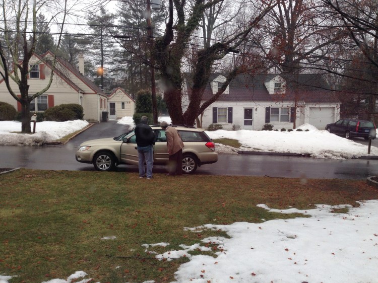 New friend. Don, who stopped by our house yesterday to photograph his wife's childhood home, talks with Basil. 